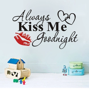 Always Kiss Me Goodnight wall decal with red lips and hearts in a cozy bedroom setting