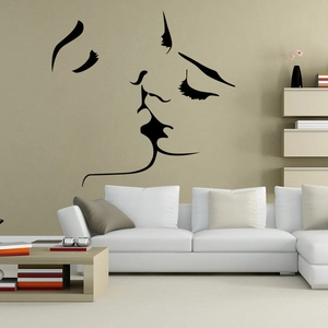 Minimalist black line art kiss wall decal for modern living room decor on beige background
