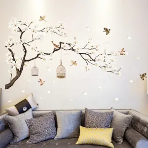 Chinese style floral wall decal with magnolia flowers and birds over a modern sofa