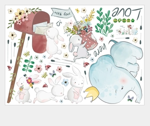 Detail view of cartoon elephant and rabbit wall stickers with watercolor floral elements