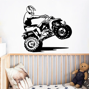 Black vinyl ATV wall decal featuring a silhouette of a rider doing a stunt in a kid's room