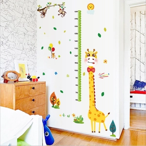 Detail of giraffe growth chart wall sticker measuring 60-180cm with monkey and sun decor