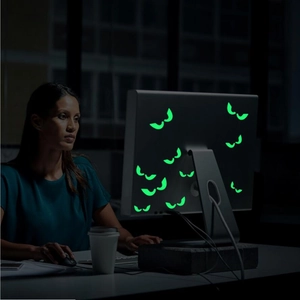 Luminous Halloween cat eye wall stickers glowing green in dark bedroom decor