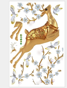 Detail view of gold deer and floral branch wall stickers with metallic texture finish