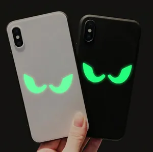 Luminous Halloween peeking eyes phone cases showing bright green glowing cat eyes in dark