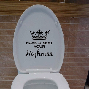 Detail showing Have a Seat Your Highness toilet lid decal with black crown icon