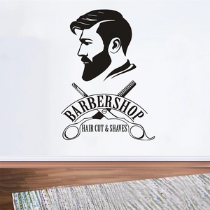Détail d'un sticker mural de barbier noir avec homme barbu, ciseaux et peigne décoratif