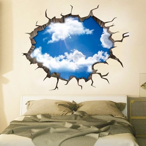 Sticker mural 3D avec effet de mur brisé montrant un ciel bleu vif et des nuages