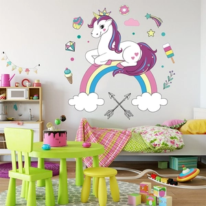 Detailed view of rainbow unicorn wall stickers set in a colorful nursery room scene