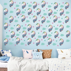 Detail of cartoon unicorn wall stickers with colorful clouds and hearts in kids' room