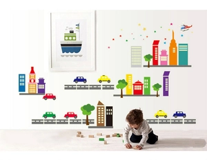 Cartoon glowing city wall stickers for kids room featuring colorful buildings and cars