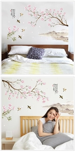 Detail of Chinese style wall decal with magnolia branches and ink mountain landscape