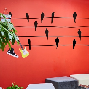 Minimalist black birds on power line wall decal for living room and nursery decor