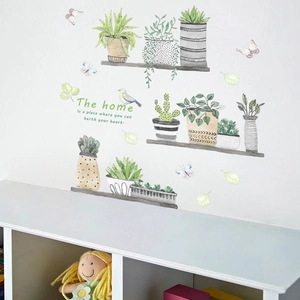 Detail of watercolor green potted plants and shelf wall decals on a white home wall