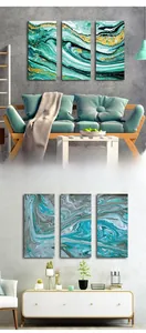 Detail view of modern abstract triptych wall art with fluid marble texture in home setting
