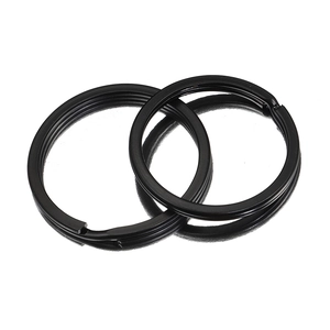 Flat black electrophoresis metal keychains in dual-layer spiral ring design on white background