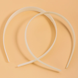 Pair of minimalist 1cm wide cream ABS plastic headbands with smooth curved surface