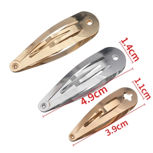 Metallic teardrop snap hair clips in gold and silver finish with floral hollow design