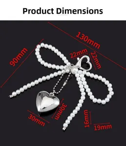 Detailed dimensions of pearl bow charm with heart mirror pendant and metal clasp