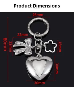 Silver metal keychain with 3D heart, bow, and flower charms in polished finish