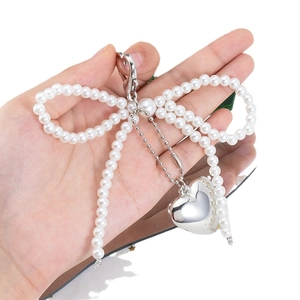 Silver pearl bow keychain with metallic heart pendant for phone case and DIY decoration