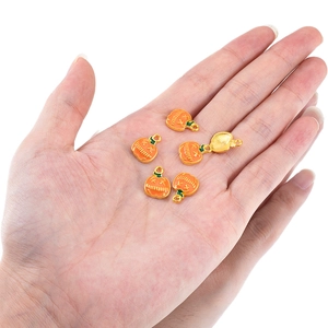 Five orange enamel pumpkin charms with golden edges for Halloween jewelry DIY making
