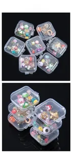 Detail view of mini transparent PP plastic storage boxes filled with colorful jewelry beads