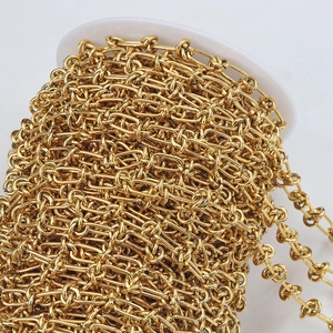 Close-up of golden twisted knot chain roll for DIY jewelry making and industrial design