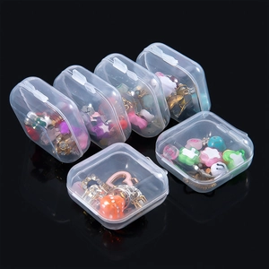 Set of six clear plastic jewelry organizer boxes with colorful DIY charm assortments