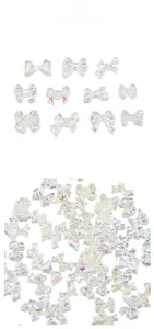 Close-up of iridescent resin aurora bow charms for 3D nail art and DIY jewelry accessories