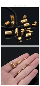 Macro shot of 18k gold plated bucket end caps for leather cords in various sizes