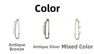 Detail of metal safety pin brooches with multiple loops in silver, bronze, and rose gold