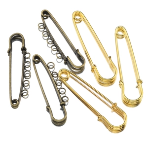 Golden and bronze large safety pins with metal loops for waist adjustment and clothing decor