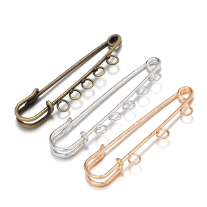 Safety pins with five loops in bronze, silver, and rose gold for DIY jewelry design