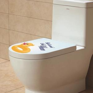 Detail of cartoon duck bathroom sticker with Ride the Wind and Waves text