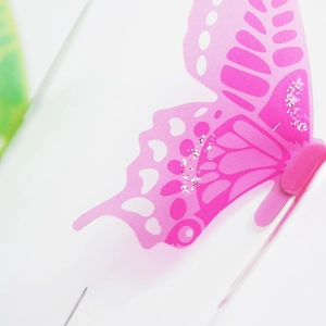 Detail of 3D pink butterfly wall sticker with hollow-out pattern and silver glitter sparkles