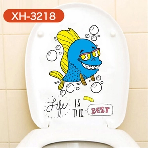 Sticker de toilette poisson bleu avec citation « Life is the Best » sur abattant blanc