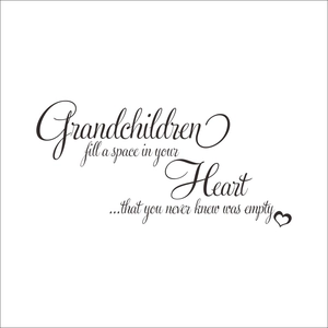 Detail of artistic black script wall decal with quote about grandchildren and heart icon