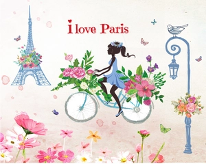 Detail of Paris wall sticker featuring blue Eiffel Tower and girl on a floral bicycle