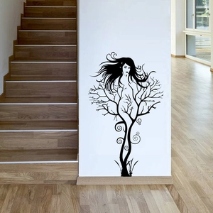 Modern silhouette wall decal featuring female form and tree branches in black minimalist style