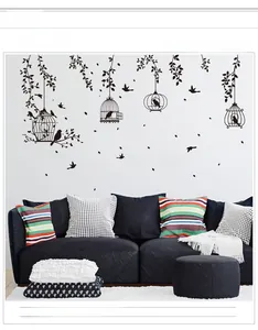 Detail of black birdcage and leaf silhouette wall sticker with 'Love' quote