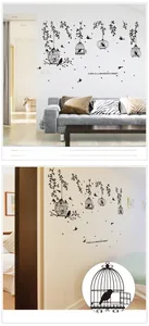 Detail view of black birdcage and leaf silhouette wall decals in a modern living room