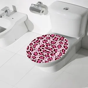 Detail of pink leopard print toilet lid sticker with waterproof PVC texture in bathroom