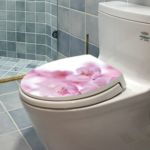 Pink floral decals on white toilet lid, sea-themed bathroom decorative stickers