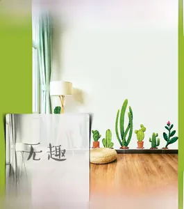 Macro detail of cactus wall decals showing fresh green potted plants and floral designs