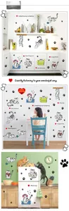 Detail of cartoon cat wall stickers applied to kitchen cabinets and home furniture surfaces