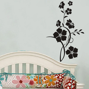 Classic black floral vine wall sticker design applied on a light blue bedroom wall surface