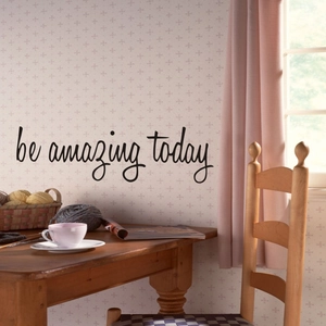 Detail view of Be Amazing Today black script wall sticker on floral textured background