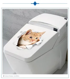 Detailed close-up of a 3D cute orange cat sticker applied on a white toilet cover lid