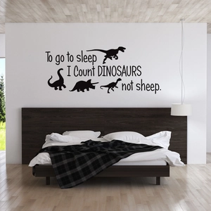 Black vinyl dinosaur wall decal with text Count DINOSAURS not sheep for kids bedroom